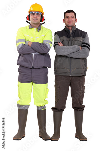 Photo: duo of craftsmen posing cross-armed duo of craftsmen posing cross-armed