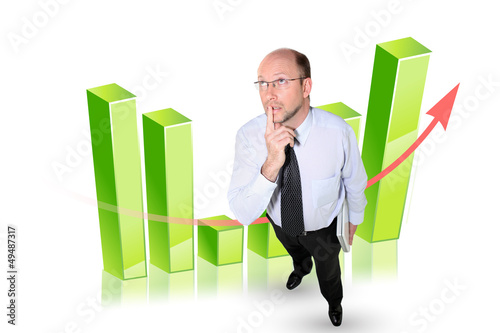 Photo: Businessman in front of a bar chart Businessman in front of a bar chart