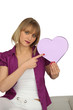 Woman holding a heart-shaped box