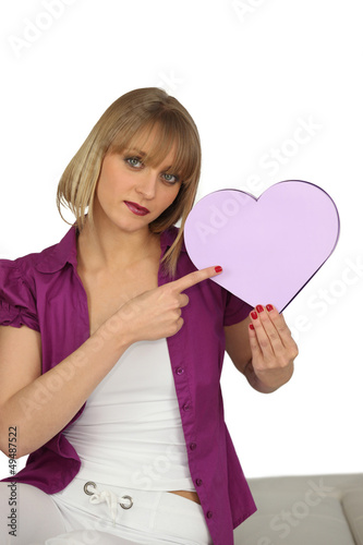 Photo: Woman holding a heart-shaped box Woman holding a heart-shaped box
