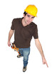 Construction worker pointing to the floor