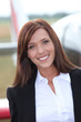 Woman in front of airplane