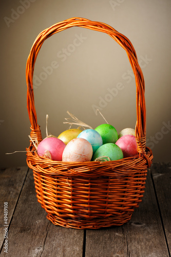 Photo: Colored easter eggs in basket Colored easter eggs in basket