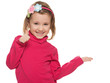 Photo: Cheerful little girl in red with her thumb up Cheerful little girl in red with her thumb up