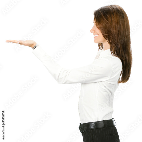 Photo: Business woman showing something, isolated Business woman showing something, isolated