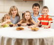 Happy family drinks tea