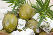 feta cheese and olives with herbs in olive oil