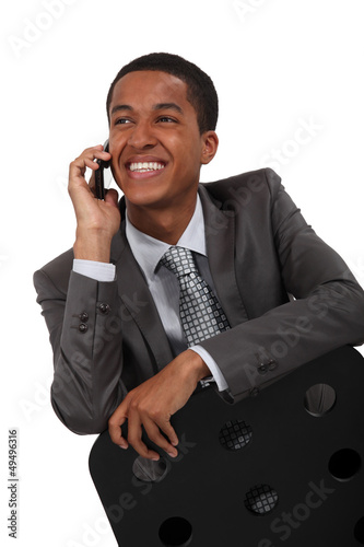 Photo: Smiling businessman talking on the phone Smiling businessman talking on the phone