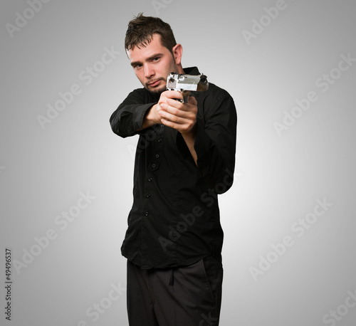 Photo: Portrait Of A Man Holding Gun Portrait Of A Man Holding Gun