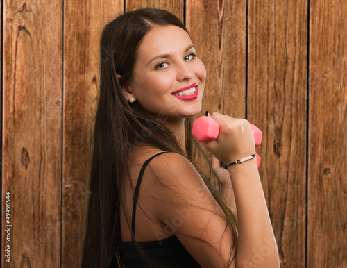 Photo: Beautiful Young Woman Exercising Beautiful Young Woman Exercising