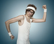 Funny retro nerd flexing his muscle over blue background