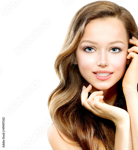 Photo: Beauty Teenage Girl Portrait isolated on a White Background Beauty Teenage Girl Portrait isolated on a White Background