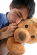 Man hugging a teddy bear