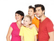 Happy family with two children looking side