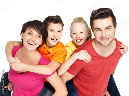 Photo: Happy family with two children on white Happy family with two children on white