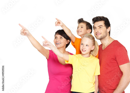Photo: family with two children pointing finger up family with two children pointing finger up