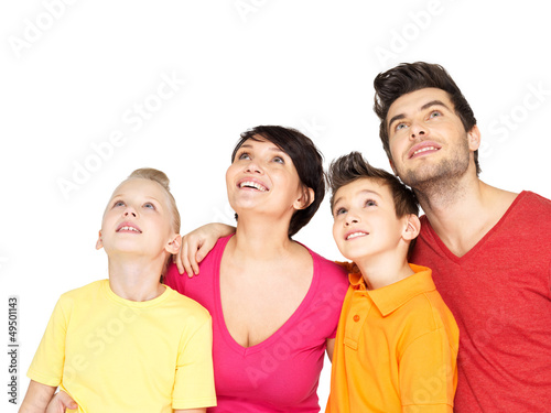 Photo: Happy family with two children looking up Happy family with two children looking up