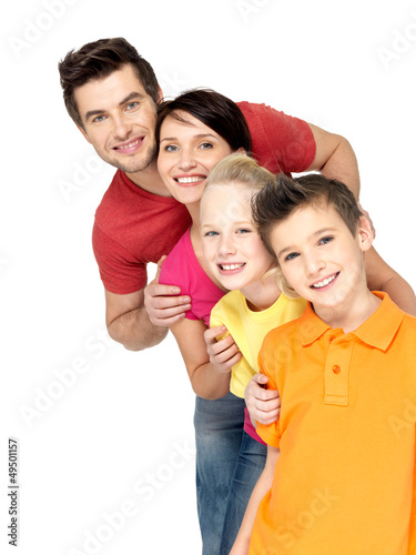 Photo: Happy family with children standing together in line Happy family with children standing together in line