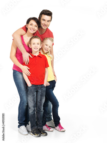 Photo: Full portrait of the happy young family with two children Full portrait of the happy young family with two children