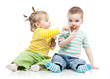 happy children little girl and boy with ice cream in studio isol