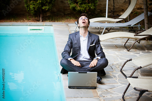 Photo: Tired Man Businessman overworking outdoors Tired Man Businessman overworking outdoors
