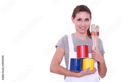 Photo: Girl with three cans of paint Girl with three cans of paint