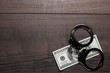 handcuffs and one hundred dollars background