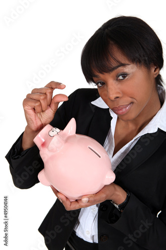 Photo: black businesswoman with piggybank black businesswoman with piggybank