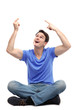Young man pointing above his head