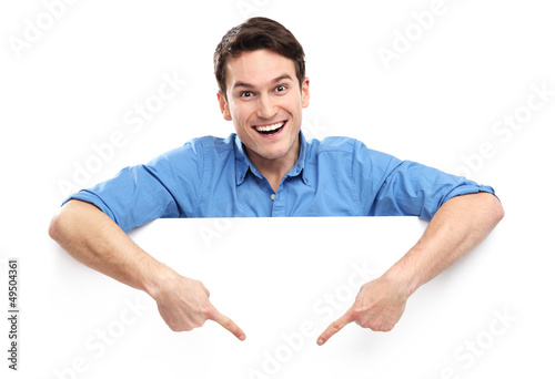 Photo: Man pointing down at empty whiteboard Man pointing down at empty whiteboard