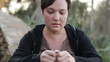 Sad woman holding a wedding ring