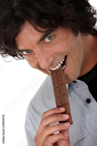Photo: Man eating chocolate Man eating chocolate