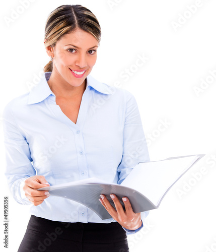 Photo: Businesswoman reading documents Businesswoman reading documents