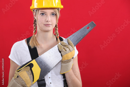 Photo: Woman with a saw Woman with a saw