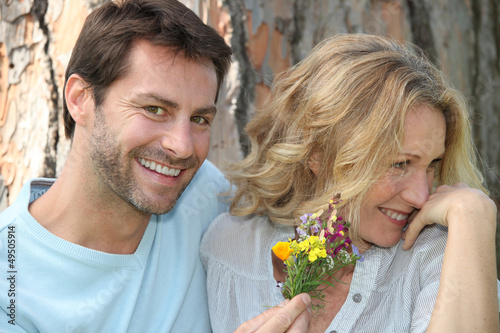 Photo: Man offering flowers Man offering flowers