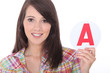 Young women holding learner plate