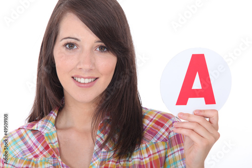 Illustration: Young women holding learner plate Young women holding learner plate