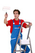 Man holding a paint roller