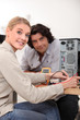 Woman assessing problem with computer