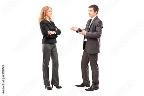 Photo: Full length portrait of a professional male and female having a Full length portrait of a professional male and female having a