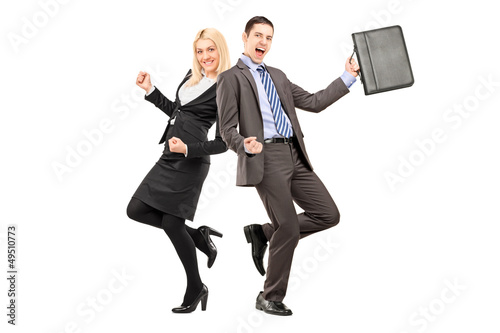 Photo: Full length portrait of a happy businesspeople celebrating succe Full length portrait of a happy businesspeople celebrating succe