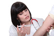 Nurse vaccinating patient