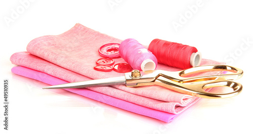 Photo: Sewing accessories and fabric isolated on white Sewing accessories and fabric isolated on white