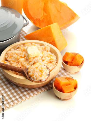 Photo: Taste rice porridge with pumpkin, isolated on white. Taste rice porridge with pumpkin, isolated on white.