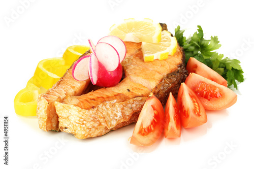Photo: Appetizing grilled salmon with lemon and vegetables isolated Appetizing grilled salmon with lemon and vegetables isolated