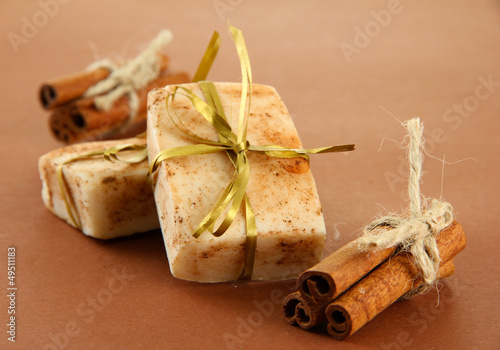 Photo: Natural handmade soap, on brown background Natural handmade soap, on brown background