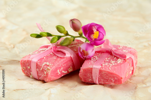 Photo: Natural handmade soap, on beige background Natural handmade soap, on beige background