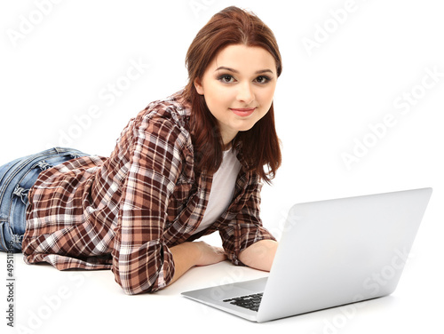 Photo: Beautiful young woman with laptop isolated on white Beautiful young woman with laptop isolated on white