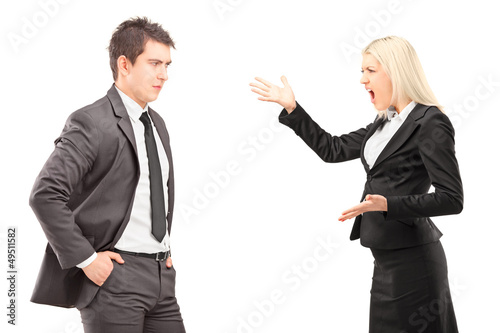 Photo: Professional male and female having an argument Professional male and female having an argument