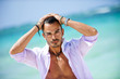 Portrait of an attractive young man on a tropical beach